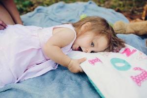 Young beautiful woman with her child outdoors photo