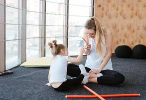 little girl and mom having fun photo