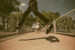 beautiful couple jumping photo