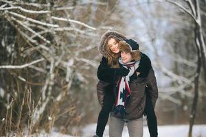 man carries a girl on his back photo