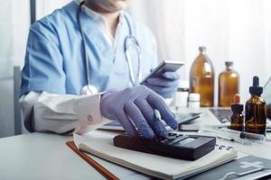 Medicine doctor and stethoscope touching icon medical network connection with modern interface on digital tablet in hospital background. Medical technology network concept photo