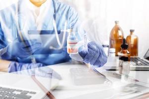 Medicine doctor and stethoscope touching icon medical network connection with modern interface on digital tablet in hospital background. Medical technology network concept photo