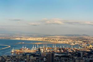 Aerial view industrial cargo port with ships and cranes photo