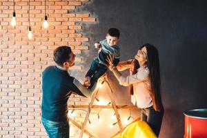 young family having fun at home photo