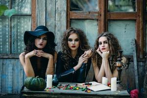 three witches at the table photo