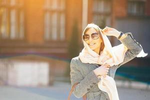 girl in a coat on the street photo