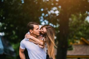 Young adult brunette man and woman in the park photo