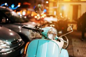 Light blue retro scooter on the street photo