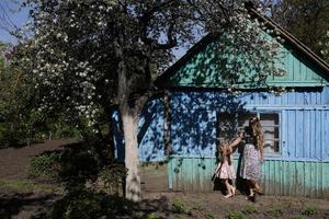 mother and daughter in the garden photo