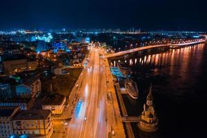 Highway at night in modern city. Aerial view of cityscape photo