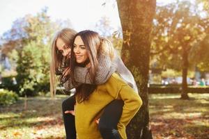 Two girls having fun in the park photo