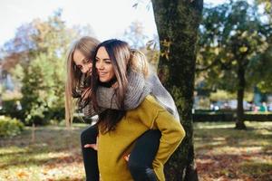 Two girls having fun in the park photo