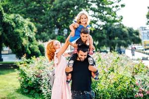 beautiful young family with ice cream photo