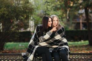 two beautiful in the park, posing for the camera photo