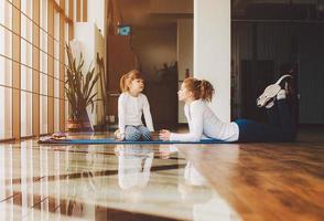 Mother and daughter have fun in the gym photo