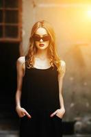 Attractive fashion woman in black dress photo