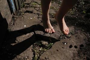 Legs of girl on the ground photo