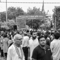 New Delhi, India July 01 2022 - A huge gathering of devotees from different parts of Delhi on the occasion of ratha yatra or rathyatra. Rath for Lord Jagannath pulled by people, Jagannath Rath Yatra photo