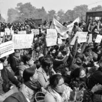 Delhi, India December 25 2021 - Delhi Contractual Guest Teachers with posters, flags and graffitis protesting against Delhi AAP Government for making policy, Delhi Teacher protesting Black and White photo