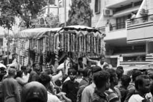 New Delhi, India July 01 2022 - A huge gathering of devotees from different parts of Delhi on the occasion of ratha yatra or rathyatra. Rath for Lord Jagannath pulled by people, Jagannath Rath Yatra photo