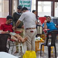 Delhi, India, June 19 2022 - Blood donor at Blood donation camp held at Balaji Temple, Vivek Vihar, Delhi, India, Image for World blood donor day on June 14 every year, Blood Donation Camp at Temple photo