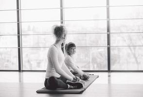 Two girls of different ages makeing yoga photo