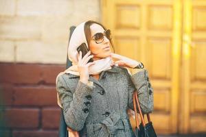 girl in a coat on the street photo