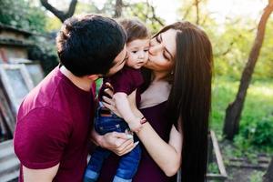 young family with a child on the nature photo