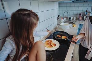 happy family cook together in the kitchen photo