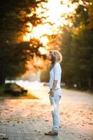 beautiful girl in sunset light photo