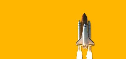 Space Shuttle isolated on yellow background. Elements of this image furnished by NASA. photo