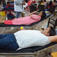 Delhi, India, June 19 2022 - Blood donor at Blood donation camp held at Balaji Temple, Vivek Vihar, Delhi, India, Image for World blood donor day on June 14 every year, Blood Donation Camp at Temple photo