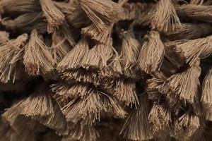 Detailed close up view on samples of cloth and fabrics in different colors found at a fabrics market photo