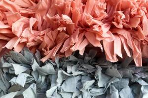 Detailed close up view on samples of cloth and fabrics in different colors found at a fabrics market photo