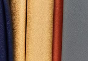 Detailed close up view on samples of cloth and fabrics in different colors found at a fabrics market photo