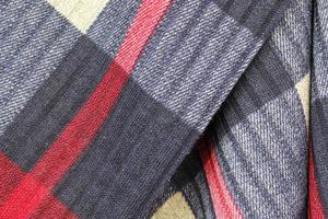 Detailed close up view on samples of cloth and fabrics in different colors found at a fabrics market photo