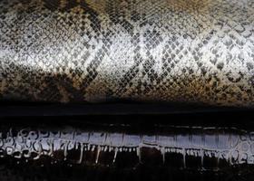 Detailed close up view on samples of cloth and fabrics in different colors found at a fabrics market photo