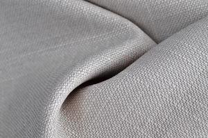 Detailed close up view on samples of cloth and fabrics in different colors found at a fabrics market photo
