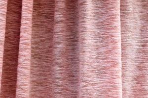 Detailed close up view on samples of cloth and fabrics in different colors found at a fabrics market photo