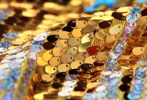 Detailed close up view on samples of cloth and fabrics in different colors found at a fabrics market photo