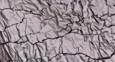 Detailed close up view on samples of cloth and fabrics in different colors found at a fabrics market photo