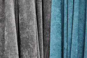 Detailed close up view on samples of cloth and fabrics in different colors found at a fabrics market photo