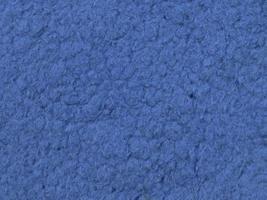Detailed close up view on samples of cloth and fabrics in different colors found at a fabrics market photo