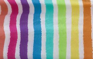 Detailed close up view on samples of cloth and fabrics in different colors found at a fabrics market photo