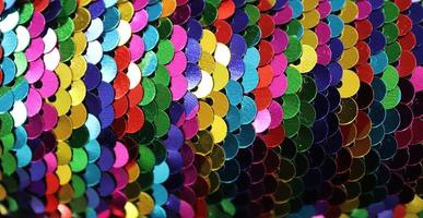 Detailed close up view on samples of cloth and fabrics in different colors found at a fabrics market photo