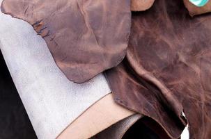 Detailed close up view on samples of cloth and fabrics in different colors found at a fabrics market photo