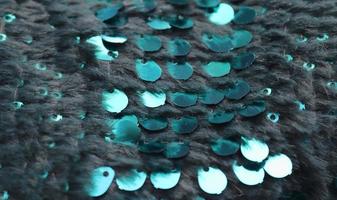 Detailed close up view on samples of cloth and fabrics in different colors found at a fabrics market photo