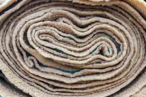 Detailed close up view on samples of cloth and fabrics in different colors found at a fabrics market photo