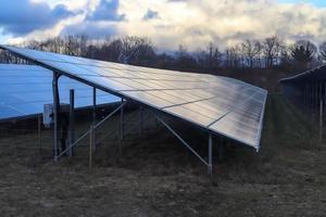Generating clean energy with solar modules in a big park in northern Europe photo