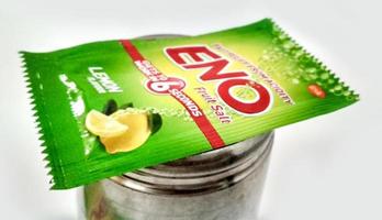 Assorted ENO products on white background. ENO is fast-acting effervescent fruit salts, used as an antacid and reliever of bloatedness by company GlaxoSmithKlin photo
